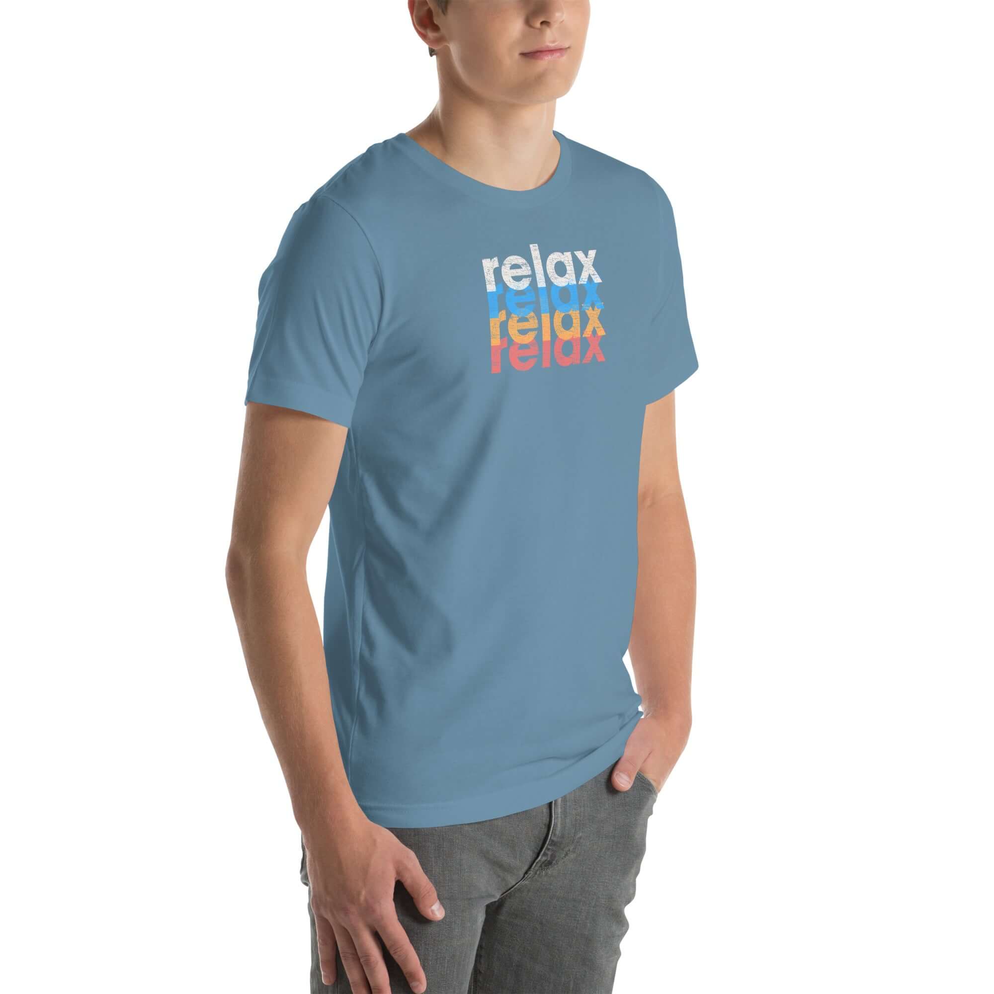 Angled front view of a man wearing a Milk Sandwich steel blue t-shirt with a colorful distressed relax text design repeated vertically in white, blue, orange, and pink.