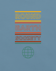 Close-up of a Milk Sandwich steel blue t-shirt featuring a colorful retro-style graphic with the words ROUND EARTH SOCIETY in yellow, orange, and red stripes above a teal globe icon.