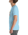 Side view of a person wearing a ocean blue Milk Sandwich t-shirt featuring a colorful "Round Earth Society" design on the front.