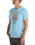 Angled side view of a person wearing a ocean blue Milk Sandwich t-shirt with a colorful "Round Earth Society" graphic design.
