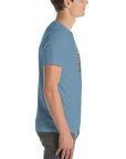 Side profile of a person wearing a steel blue Milk Sandwich t-shirt featuring a vertical "Round Earth Society" graphic design on the front.