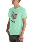 Man in a mint Milk Sandwich t-shirt with a humorous sloth illustration and the text I farted underneath, standing with one hand in his pocket.