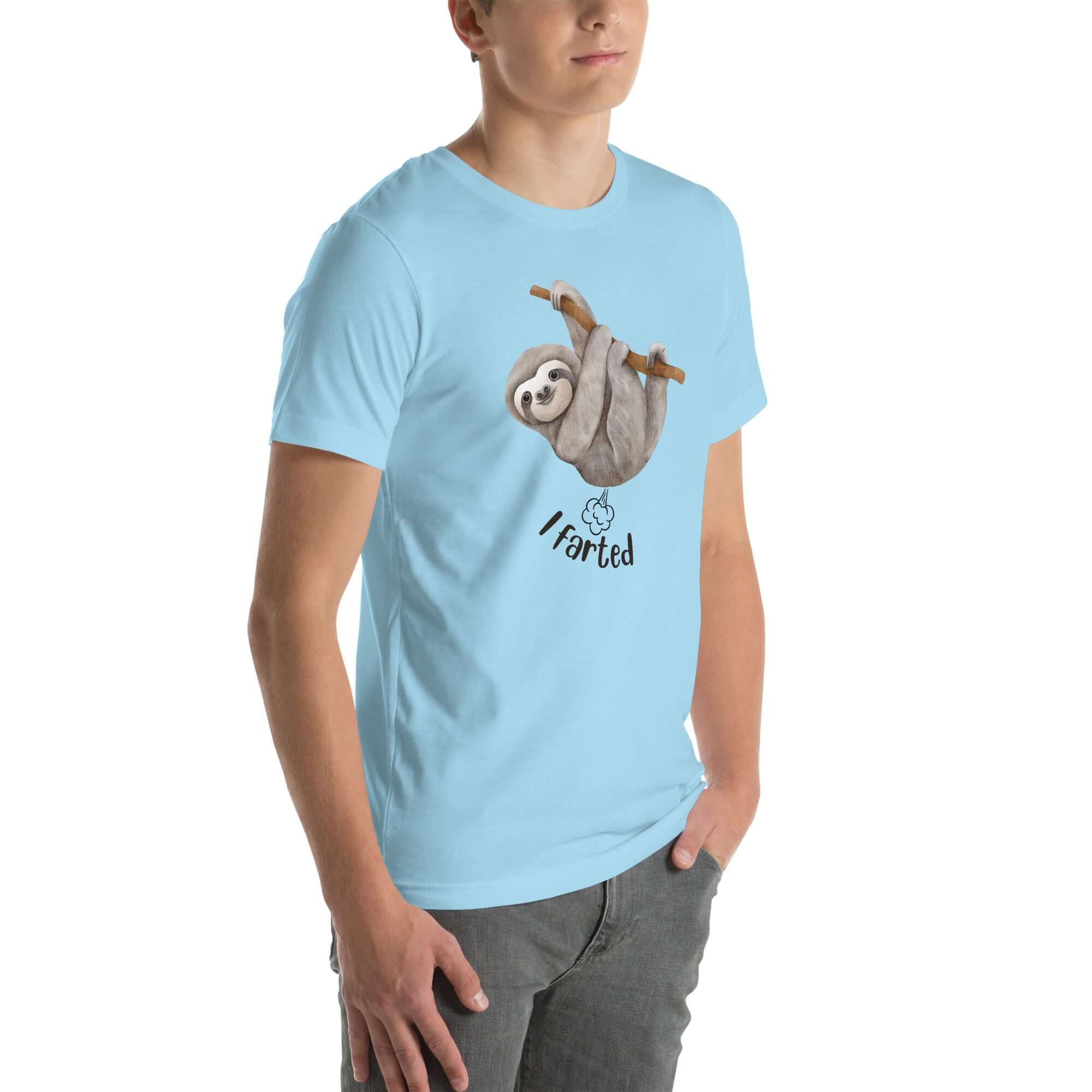 Side view of a man wearing a light blue Milk Sandwich t-shirt featuring a playful cartoon sloth hanging from a branch with the phrase I farted and a small puff cloud illustration underneath.