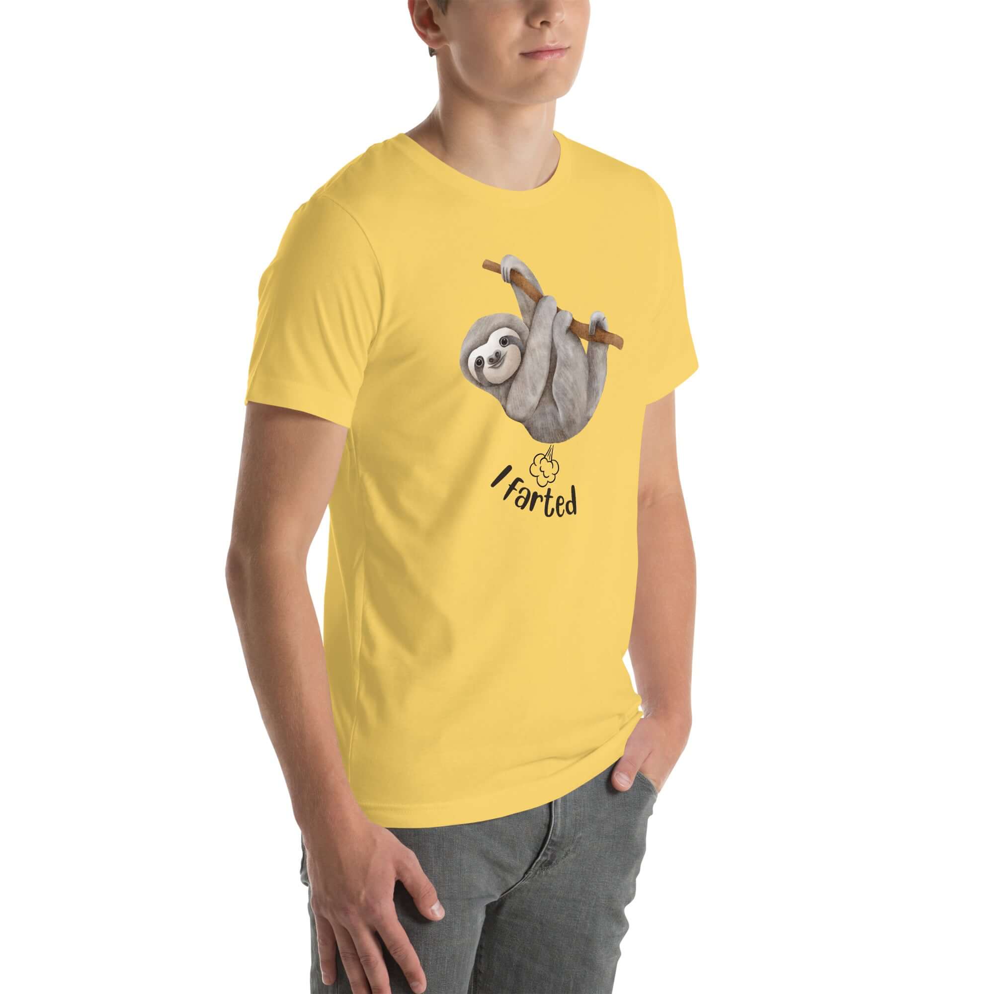 Side view of a man wearing a yellow Milk Sandwich t-shirt featuring a playful cartoon sloth hanging from a branch with the phrase I farted and a small puff cloud illustration underneath.