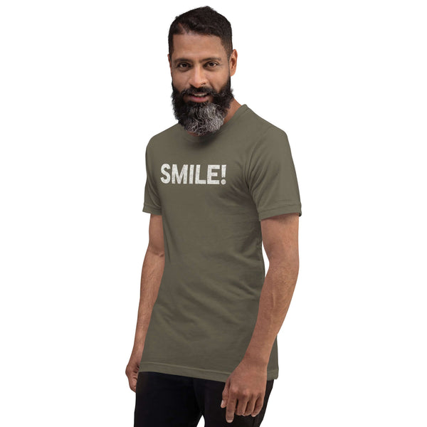 Man in a army Milk Sandwich t-shirt featuring the word "SMILE!" in bold, distressed white letters, posing confidently with a slight turn against a white background.