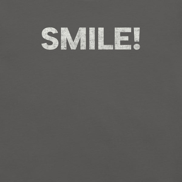 Close-up of a asphalt Milk Sandwich t-shirt with the word "SMILE!" printed in bold, distressed white text across the chest.