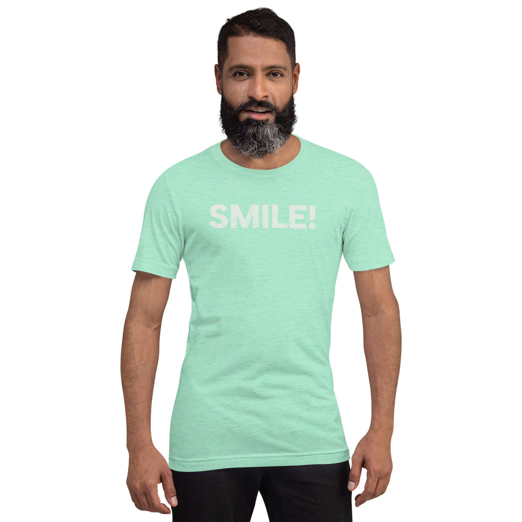 Man wearing a heather mint Milk Sandwich t-shirt with the word "SMILE!" in bold, distressed white lettering across the chest, standing confidently against a plain background.