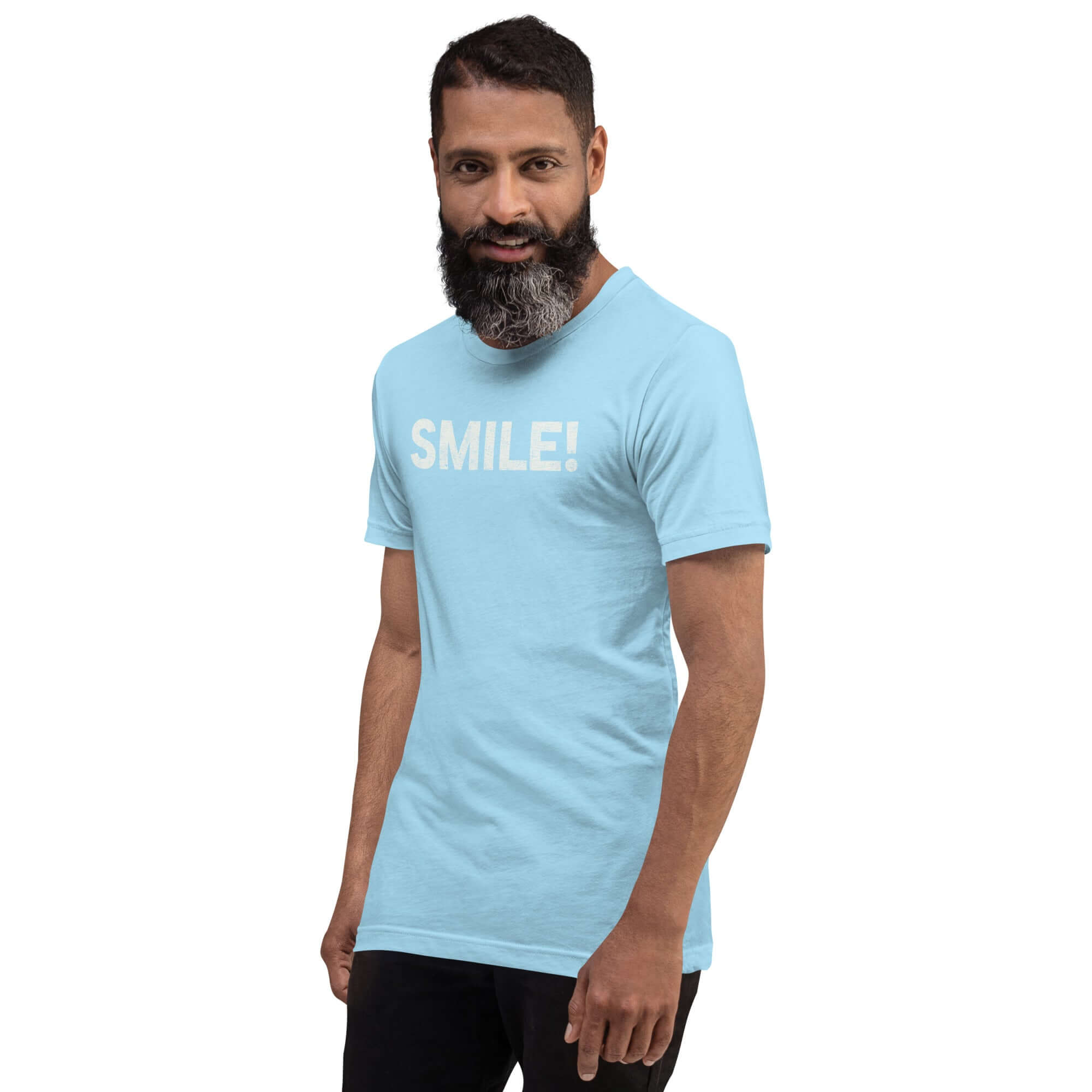 Man in a ocean blue Milk Sandwich t-shirt featuring the word "SMILE!" in bold, distressed white letters, posing confidently with a slight turn against a white background.