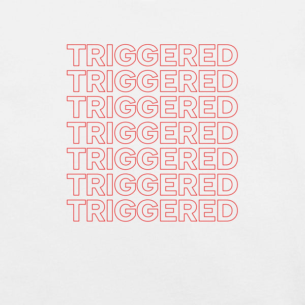 Close-up of white t-shirt with repeated red “TRIGGERED” text stacked in a bold outline font.