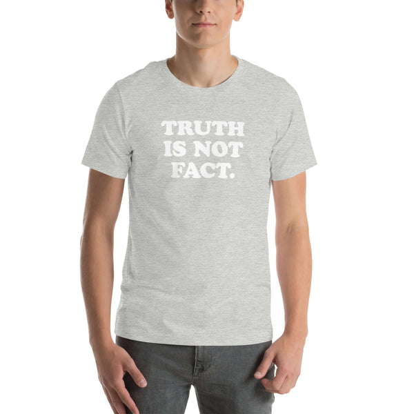 Unisex  Milk Sandwich T-shirt featuring bold text "Truth is Not Fact" on a soft gray fabric, perfect for any casual outfit.