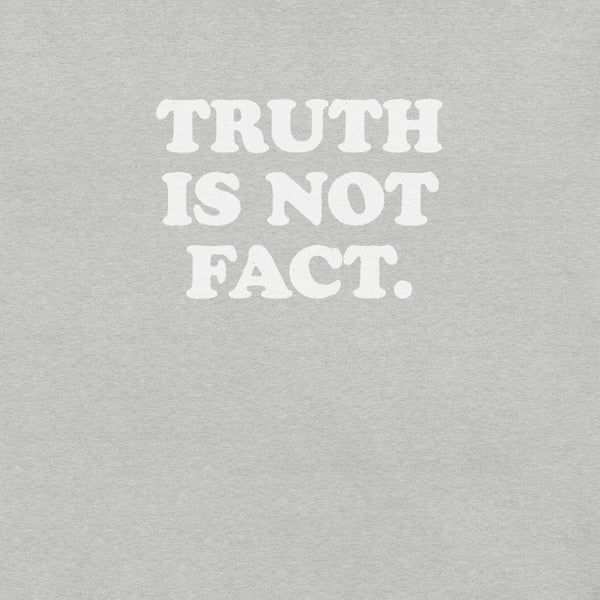 Close-up of athletic heather Milk Sandwich T-shirt with bold white text that reads Truth Is Not Fact, minimalist graphic tee with a bold statement.