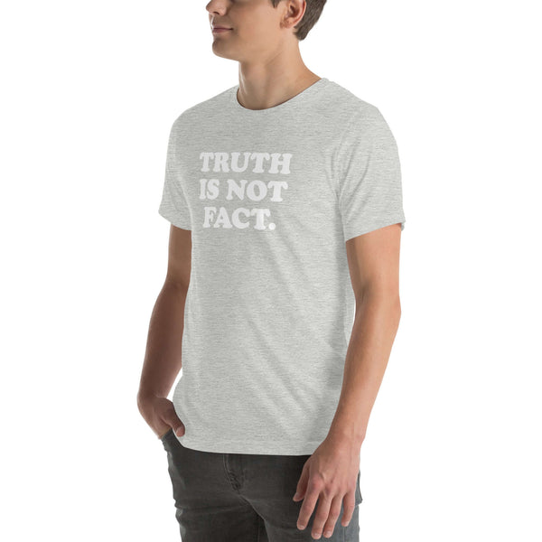 Unisex soft grey Milk Sandwich T-shirt displaying the phrase "Truth is Not Fact" in bold white letters, perfect for casual wear.
