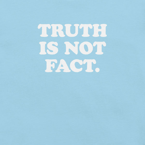 Close-up of ocean blue Milk Sandwich T-shirt with bold white text that reads Truth Is Not Fact, minimalist graphic tee with a bold statement.