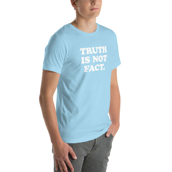 Unisex light blue Milk Sandwich T-shirt with the phrase "Truth is Not Fact" displayed prominently on the front. Perfect for comfortable wear.