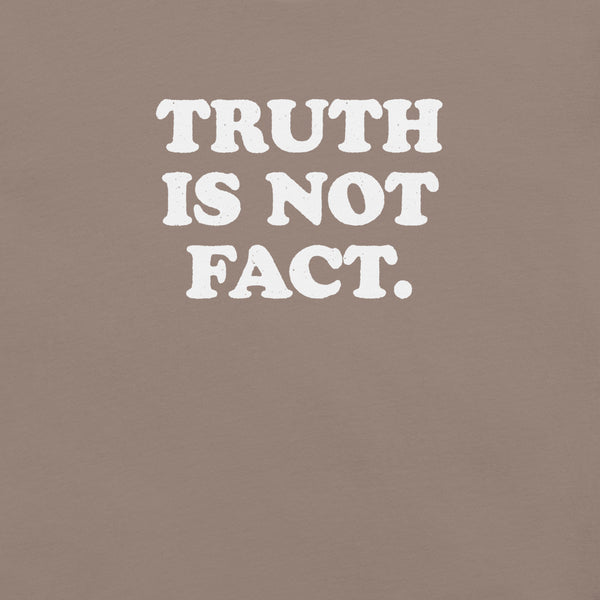 Close-up of pebble Milk Sandwich T-shirt with bold white text that reads Truth Is Not Fact, minimalist graphic tee with a bold statement.