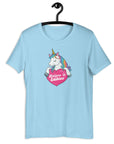 Ocean Blue t-shirt on a hanger with a colorful unicorn graphic above a pink heart that says “Believe in Edibles.”