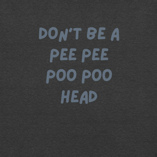 Man wearing dark grey “DON’T BE A PEE PEE POO POO HEAD” t-shirt, standing casually with hands by pockets.