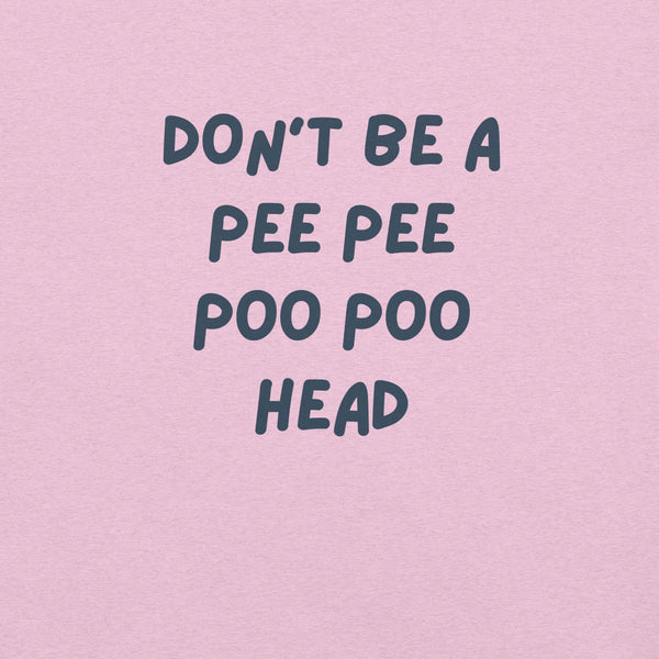 Man wearing lilac “DON’T BE A PEE PEE POO POO HEAD” t-shirt, standing casually with hands by pockets.