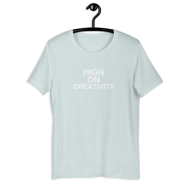 Ice Blue t-shirt on a hanger with the phrase “HIGH ON CREATIVITY” printed in white, centered on the chest.
