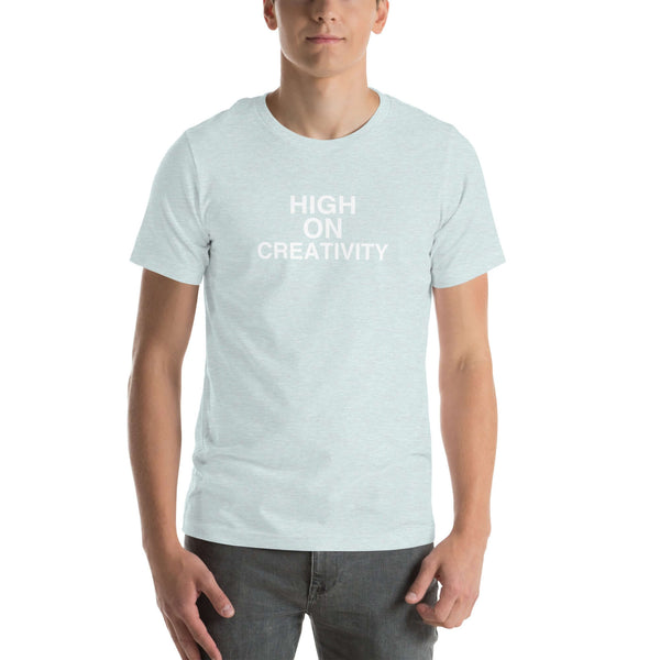 Man wearing a ice blue t-shirt with the text ‘HIGH ON CREATIVITY’ in bold white capital letters, centered on the chest