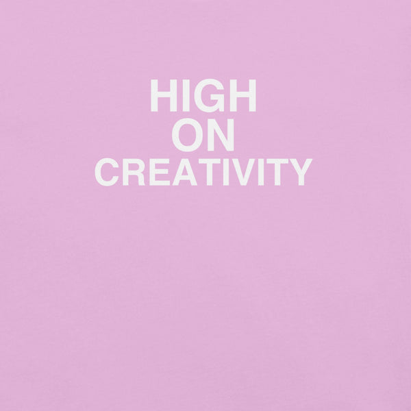 Close-up of Lilac t-shirt fabric with the phrase “HIGH ON CREATIVITY” printed in bold white uppercase letters in three lines.