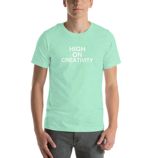 Man wearing a mint t-shirt with the text ‘HIGH ON CREATIVITY’ in bold white capital letters, centered on the chest