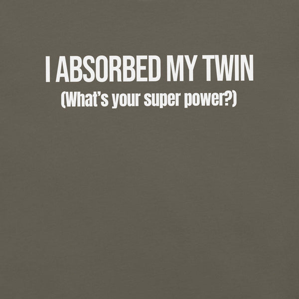 Close-up of army t-shirt with white text “I ABSORBED MY TWIN (What’s your super power?)” printed on the front.