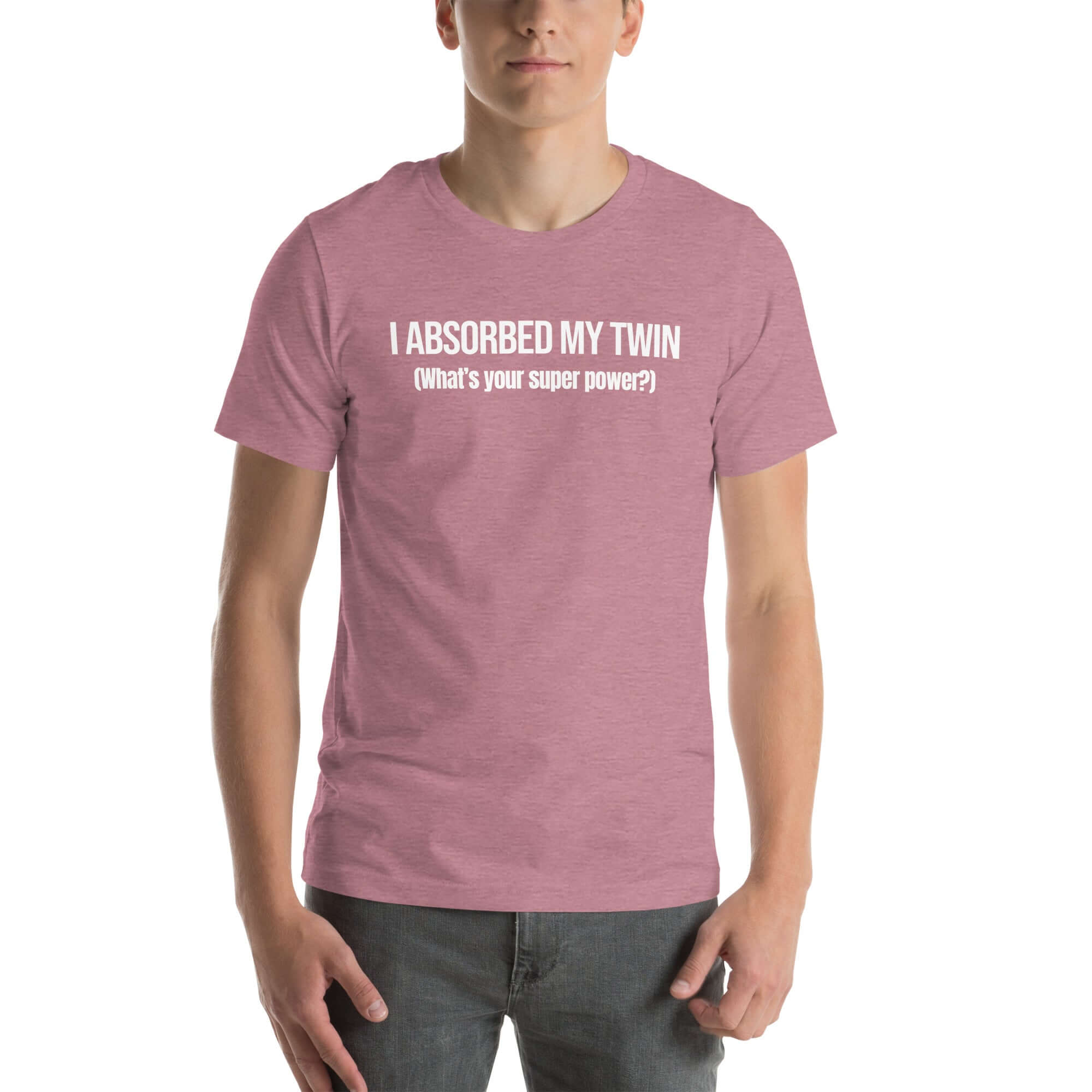 Man wearing orchid “I ABSORBED MY TWIN (What’s your super power?)” t-shirt, standing facing forward with hands relaxed.        