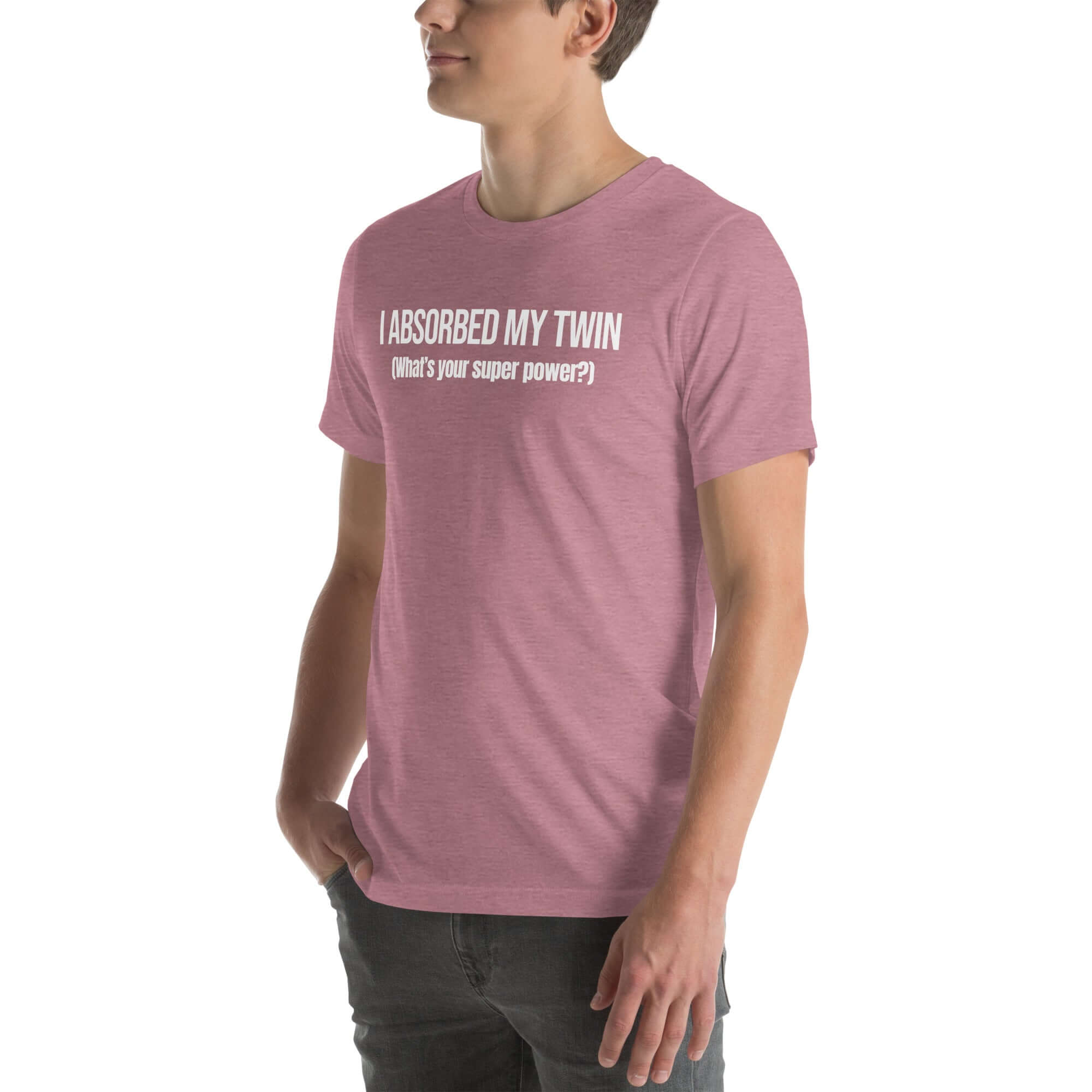 Man wearing orchid “I ABSORBED MY TWIN (What’s your super power?)” t-shirt, standing sideways with hands in pockets.