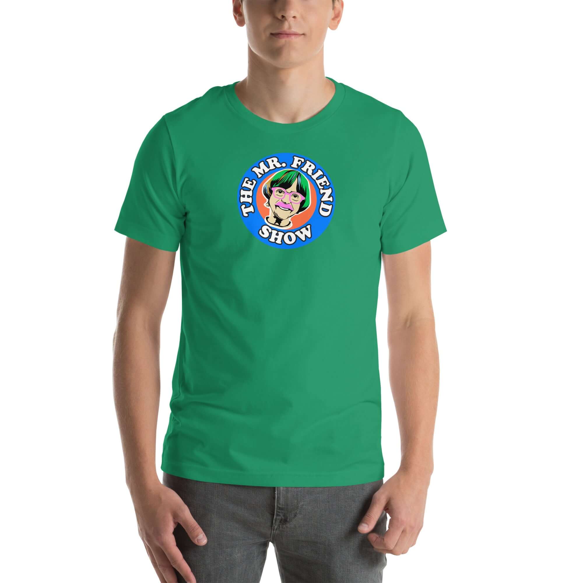 Man wearing a green t-shirt featuring 'The Mr. Friend Show' logo with a colorful illustrated portrait and retro-style typography