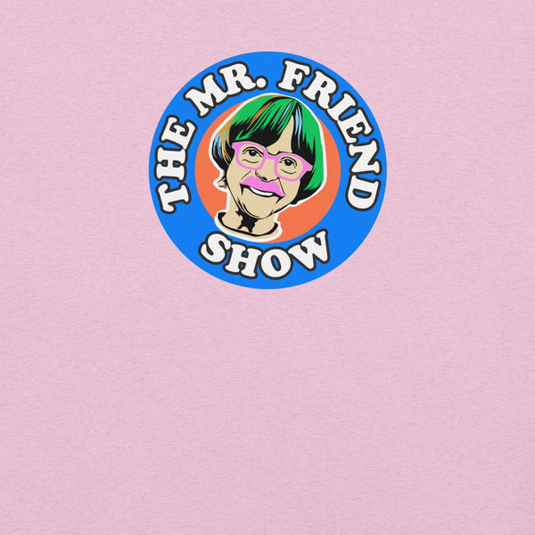 The Mr. Friend Show logo featuring a colorful illustrated portrait of an elderly person with green hair, pink glasses, and a pink mustache, on a pink t-shirt background.