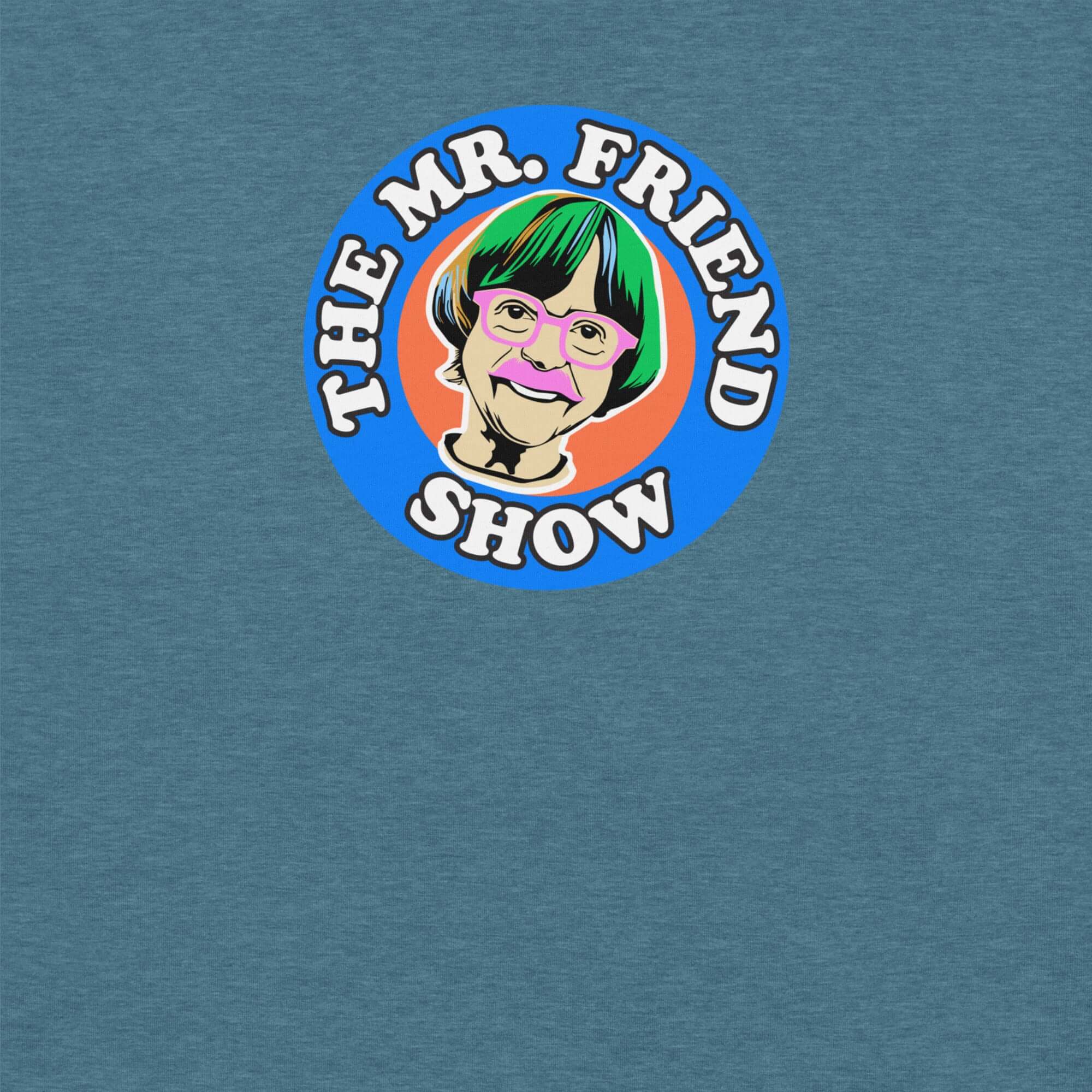 The Mr. Friend Show logo featuring a colorful illustrated portrait of an elderly person with green hair, pink glasses, and a pink mustache, on a blue t-shirt background.