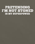 Close-up of army t-shirt with white text that says “PRETENDING I’M NOT STONED IS MY SUPERPOWER.”