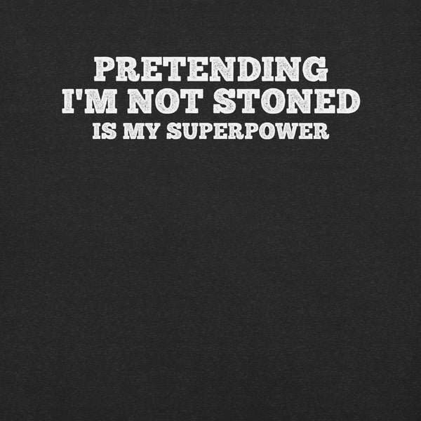 Close-up of black t-shirt with white text that says “PRETENDING I’M NOT STONED IS MY SUPERPOWER.”
