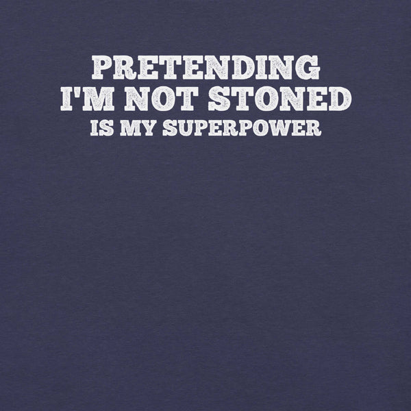 Close-up of navy t-shirt with white text that says “PRETENDING I’M NOT STONED IS MY SUPERPOWER.”