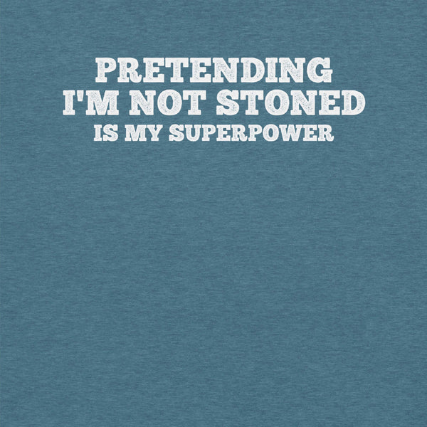 Close-up of teal t-shirt with white text that says “PRETENDING I’M NOT STONED IS MY SUPERPOWER.”