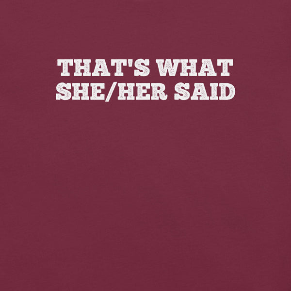 Close-up of maroon t-shirt with bold white text “THAT’S WHAT SHE/HER SAID” across the chest
