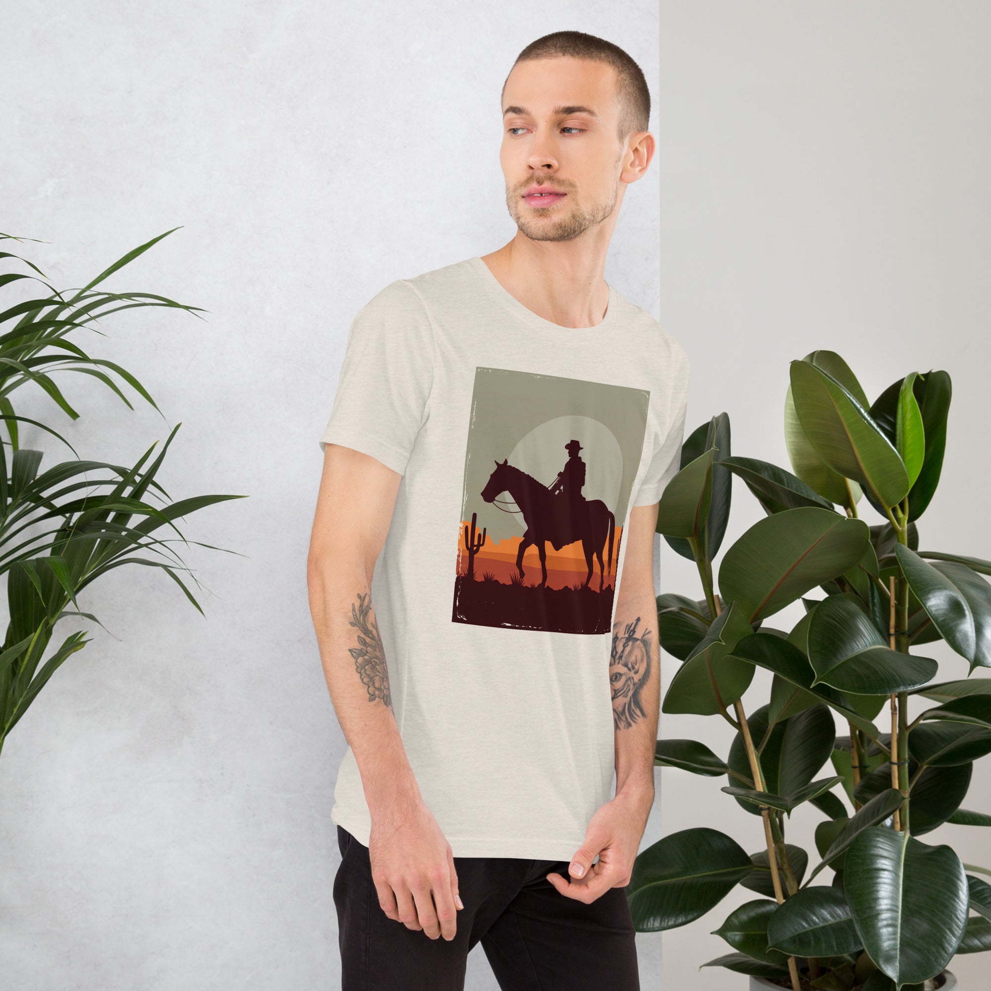 Unisex t-shirt featuring a cowboy silhouette on horseback, perfect for a relaxed and stylish look in soft, lightweight fabric.