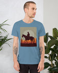 Unisex t-shirt featuring a cowboy silhouette against a sunset, perfect for casual, stylish wear in any season.