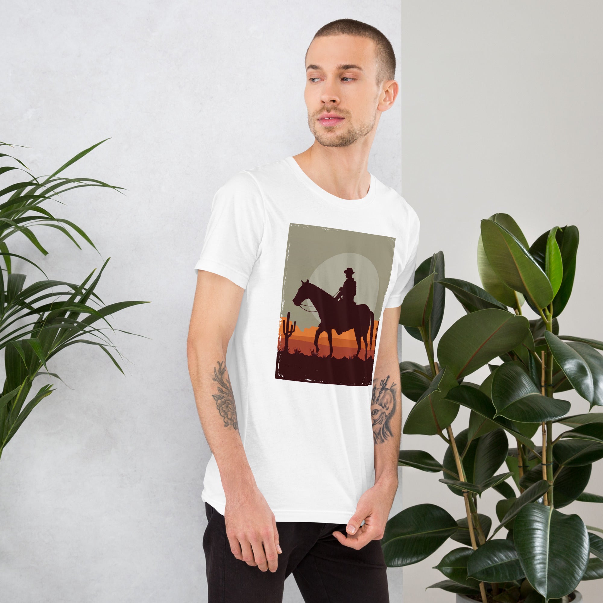 Stylish unisex t-shirt featuring a cowboy silhouette against a sunset, perfect for casual wear and nature lovers.